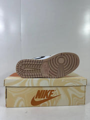 Bottom view showing the tan rubber outsole and circular traction pattern.