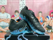 Angled view of black Nike basketball sneakers showing textured uppers, side swoosh detailing, and blue translucent outsoles.