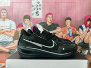 Side view of a black basketball sneaker showing the silver Swoosh, textured upper, layered midsole and rubber outsole.