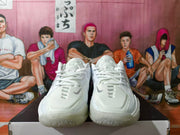 Front view of the white Nike GT Cut shoes with lace-up closure.