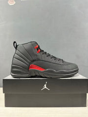 Side profile of a black and red high-top sneaker displayed on a Jordan-branded box.