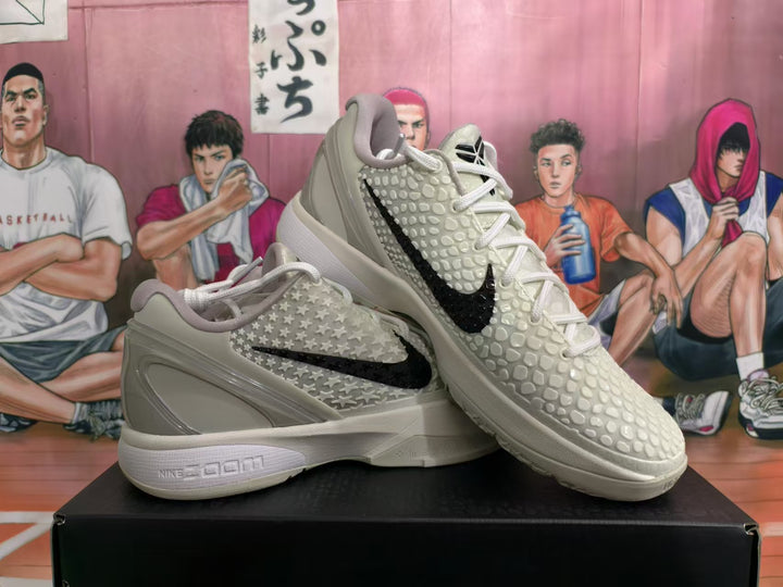 Pair of white and gray Nike All-Star 2.0 basketball shoes with black Swoosh logos and raised patterned uppers.