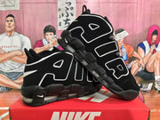Angled view of the pair highlighting the AIR lettering, padded upper details and black outsole.