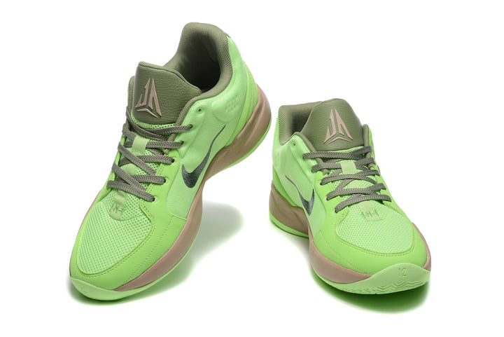 Pair of bright green Nike Ja basketball shoes with olive laces and tan midsoles, shown from front and side.