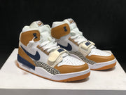 Pair of high-top sneakers shown from a front three-quarter view with elephant-print side overlays and navy accents.
