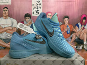 Angled view of the blue Nike basketball sneaker pair, highlighting the side branding, textured upper, padded collar, and blue outsole.