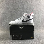 Repeat view of the white and black high-top sneaker displayed on its black box with a visible size label.