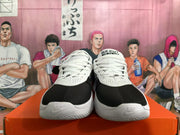 Front view of black and white Nike GT Cut Academy shoes with white laces