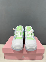 Front view of the pair showing white toe boxes, lime green tongue and mesh details, and white laces.