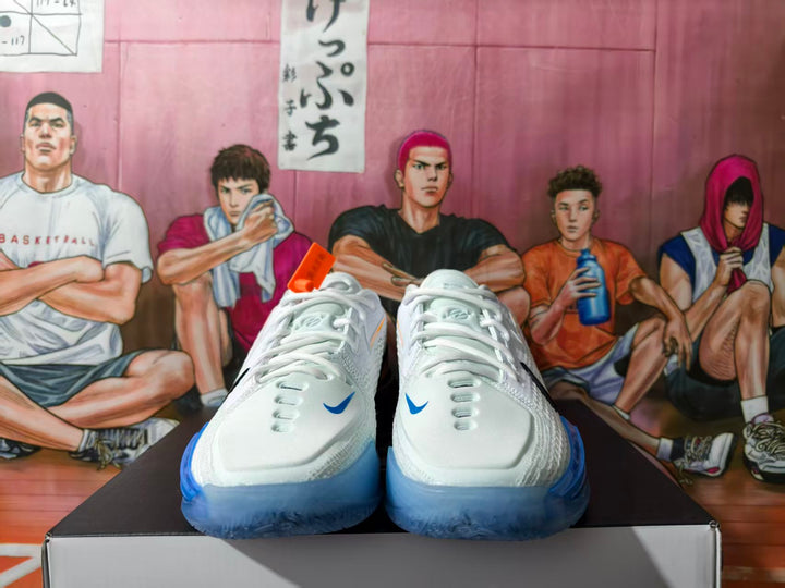 Front view of white Nike basketball shoes with blue accents and translucent blue soles.