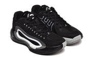 Angled view of the black and white Jordan sneakers highlighting the lace-up upper and side panels.