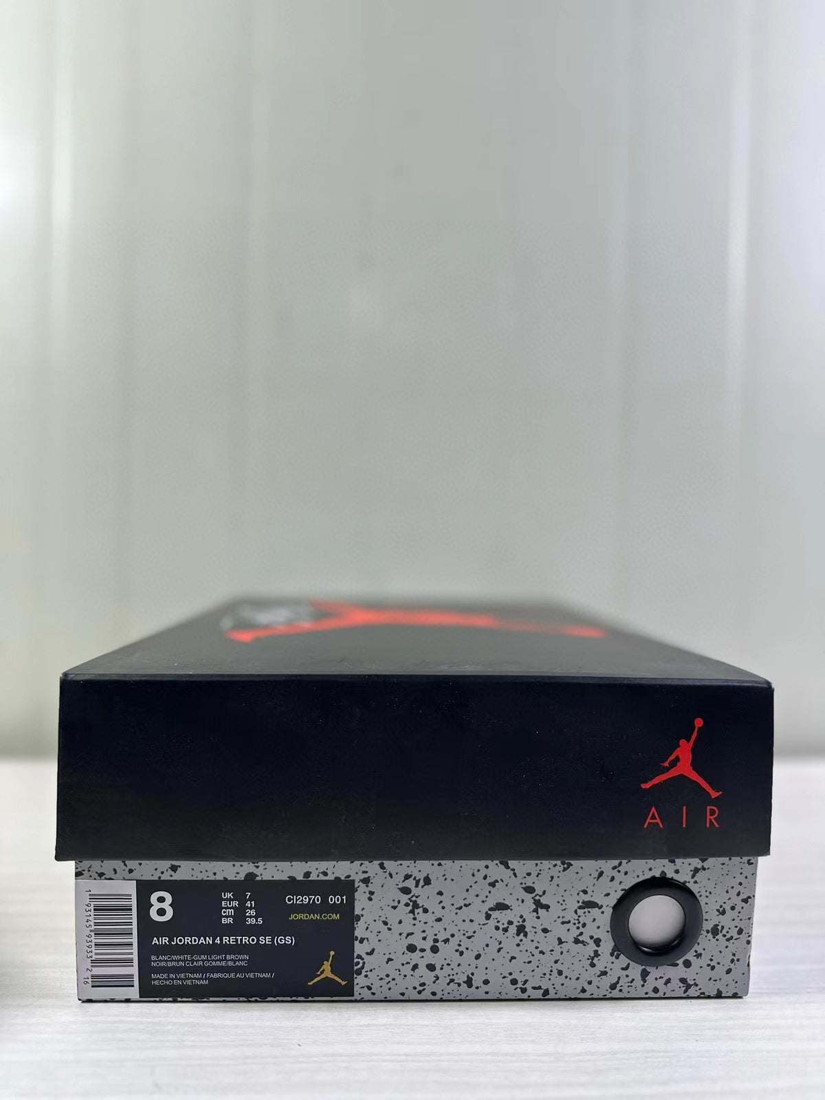 Black Jordan shoebox with a visible label identifying Air Jordan 4 Retro SE (GS), style code CI2970 001, and sample size 8.