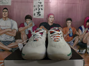 Front view of the pair showing white laces, multicolor tongue panels, green toe accents and visible Nike branding.