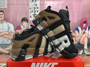 Angled view highlighting the oversized side lettering and black, brown, and light neutral color blocking.