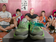 Front view showing the grey and green Nike Kobe shoes and laces