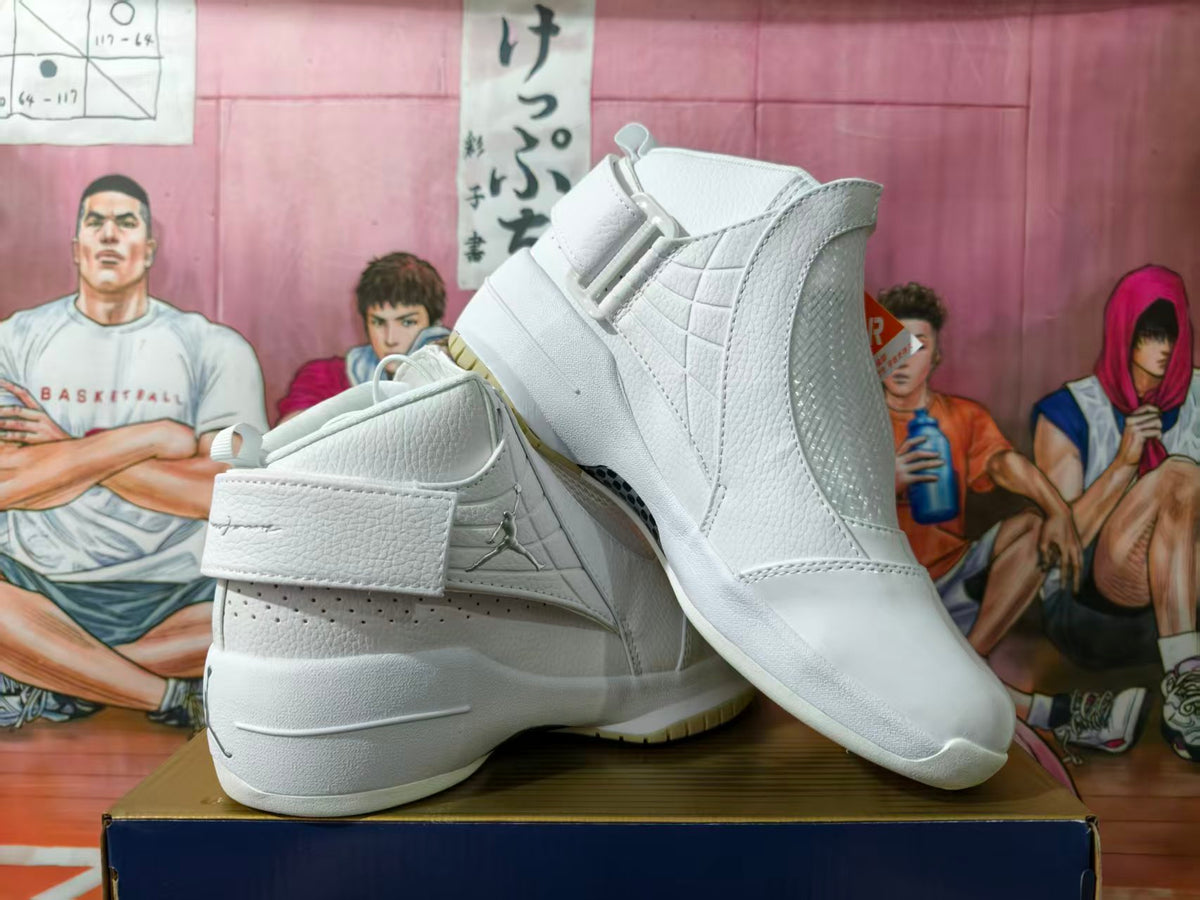 Pair of white Jordan high-top basketball shoes shown from the side, with ankle straps and textured panels.