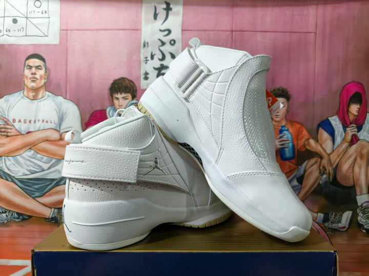 Pair of white Jordan high-top basketball shoes shown from the side, with ankle straps and textured panels.