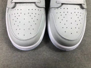Close-up of the perforated gray toe boxes and stitched panel edges.