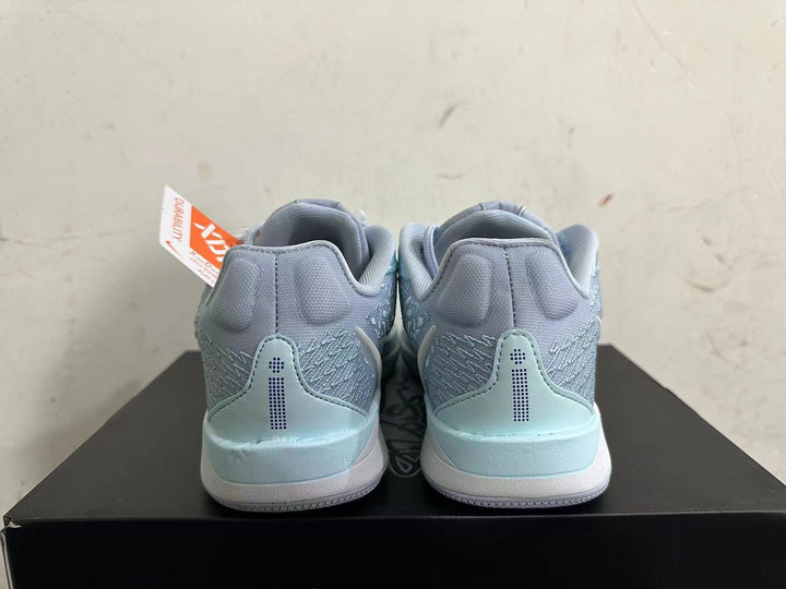 Rear view of light blue and gray Nike Sabrina 2 basketball shoes