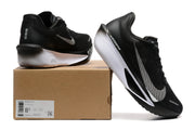 Black Nike Zoom Fly 6 shoe with white and gray accents beside a labeled shoe box.