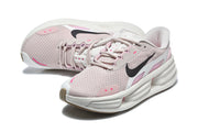 Top and side view of pale pink Nike sneakers with black Swoosh branding