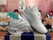Angled view of the paired white and grey Jordan basketball sneakers showing side detailing and outsole construction.