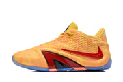 Side view of a yellow and orange basketball shoe with red side accents and a blue outsole