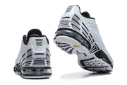 Rear views of the sneakers showing striped heel details and visible cushioning.