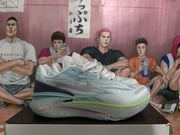 Side view of a light blue basketball sneaker with a gray Nike Swoosh, lime green accent, purple heel detail, and speckled midsole.
