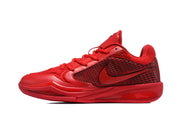Side profile of a red Nike basketball sneaker with a patterned side panel and Swoosh design.
