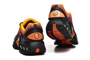 Rear and outsole views of Nike Air Max DN sneakers.