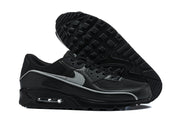 Nike Air Max 90 sneakers showing the silver Swoosh, visible Air unit and treaded outsole.