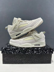 Two sneakers stacked to show their side panels, lace cages, and sole units.