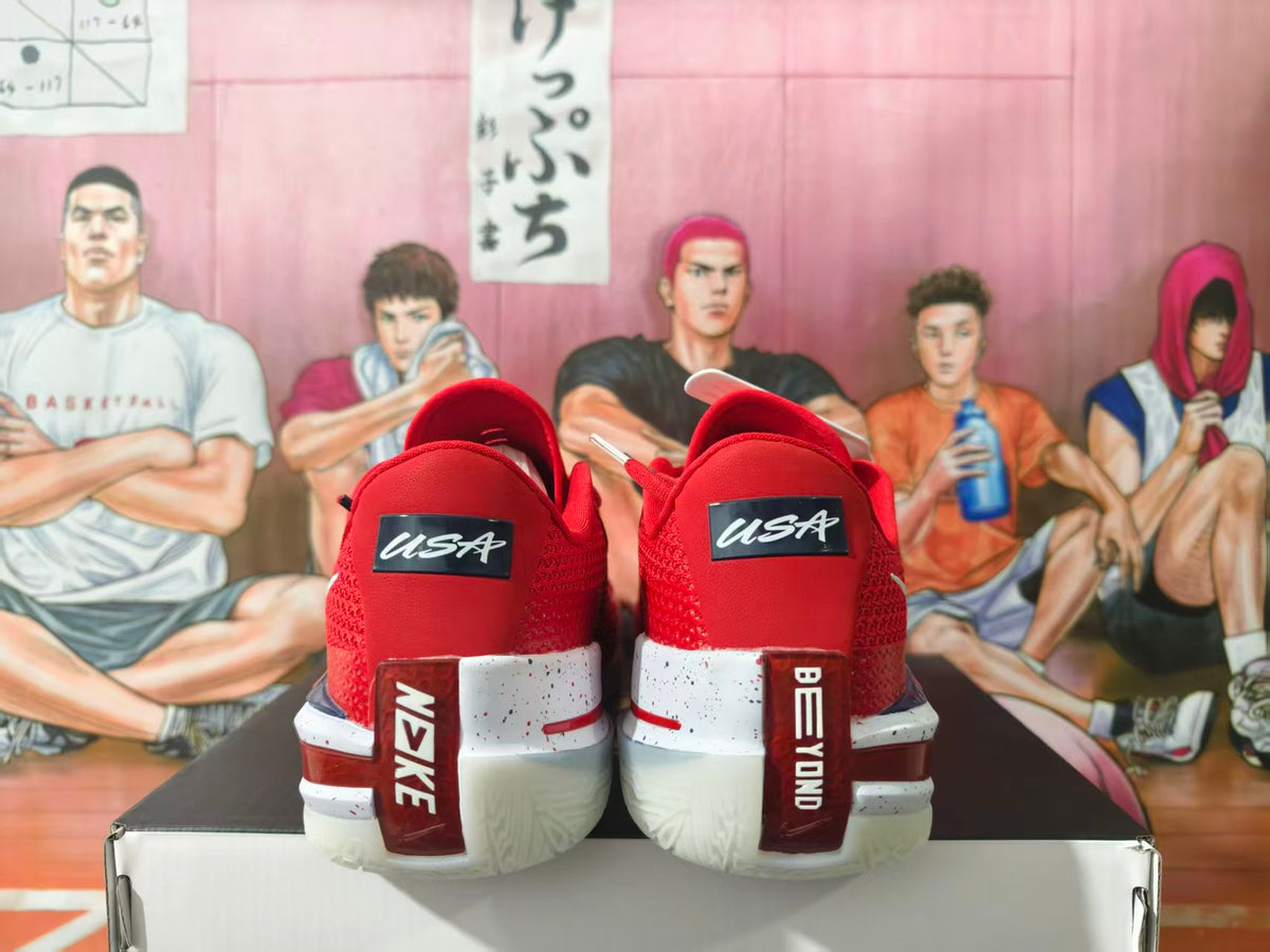 Rear view of red Nike basketball shoes with USA heel lettering and a white speckled midsole.