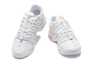 Front view of a pair of white Nike Air Max Plus sneakers with orange tongue details.