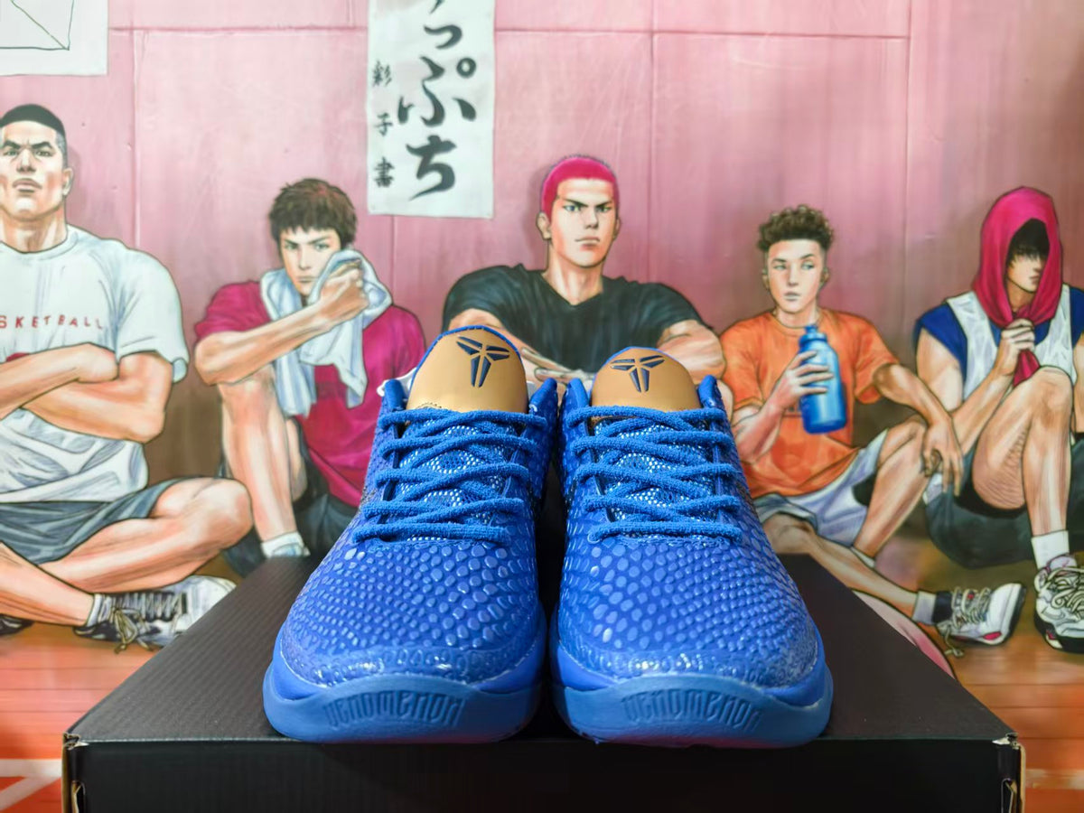 Front view of blue Nike Kobe basketball sneakers with textured uppers and Kobe logos on the tongues.