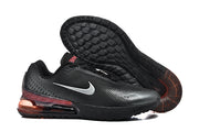 Black Nike Air Max 720 sneakers shown from the side and underside, highlighting the tread and red-tinted heel unit.