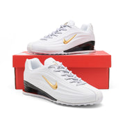 White and gold Nike Shox Z R2 sneakers displayed on a red shoe box