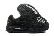Black sneaker pair showing the rugged outsole and layered side panels.