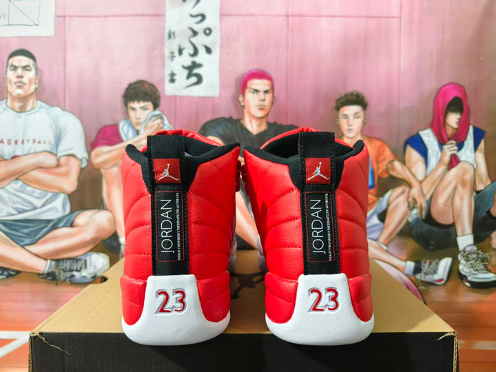 Rear view of red and white Jordan high-top sneakers with black heel tabs and number 23 details.