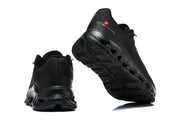 Black On running shoes shown from the heel and outsole.