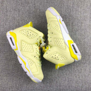 Top and side view showing the pale yellow uppers, perforated panels, white midsoles, and yellow details.