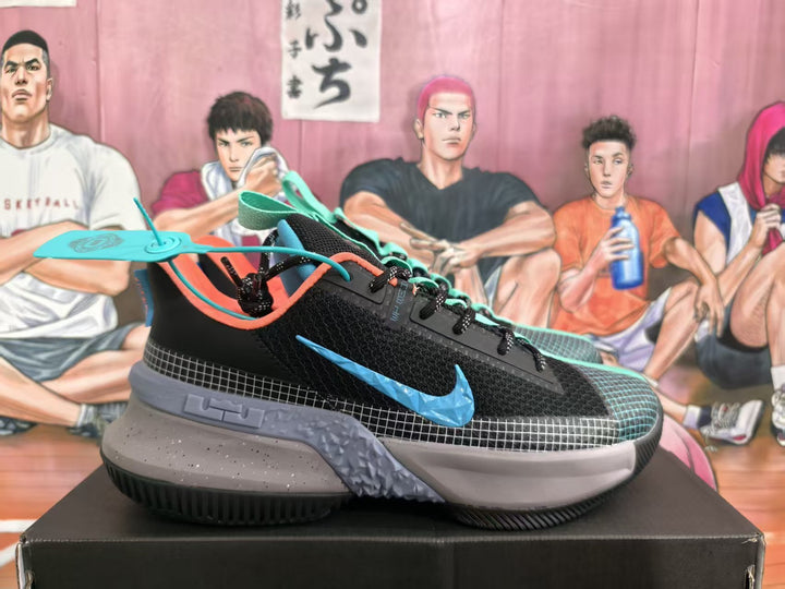 Side view of black Nike basketball sneakers with blue Swoosh branding, mint laces, gray midsole, and black outsole.