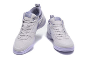 Pair of purple Nike low-top sneakers shown from the front and three-quarter angle.