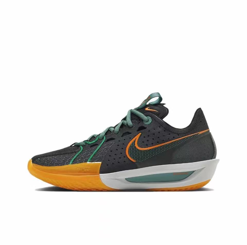 Side view of a black Nike GT Cut 3 sneaker with green laces, orange Swoosh detailing, and a gum-colored outsole.