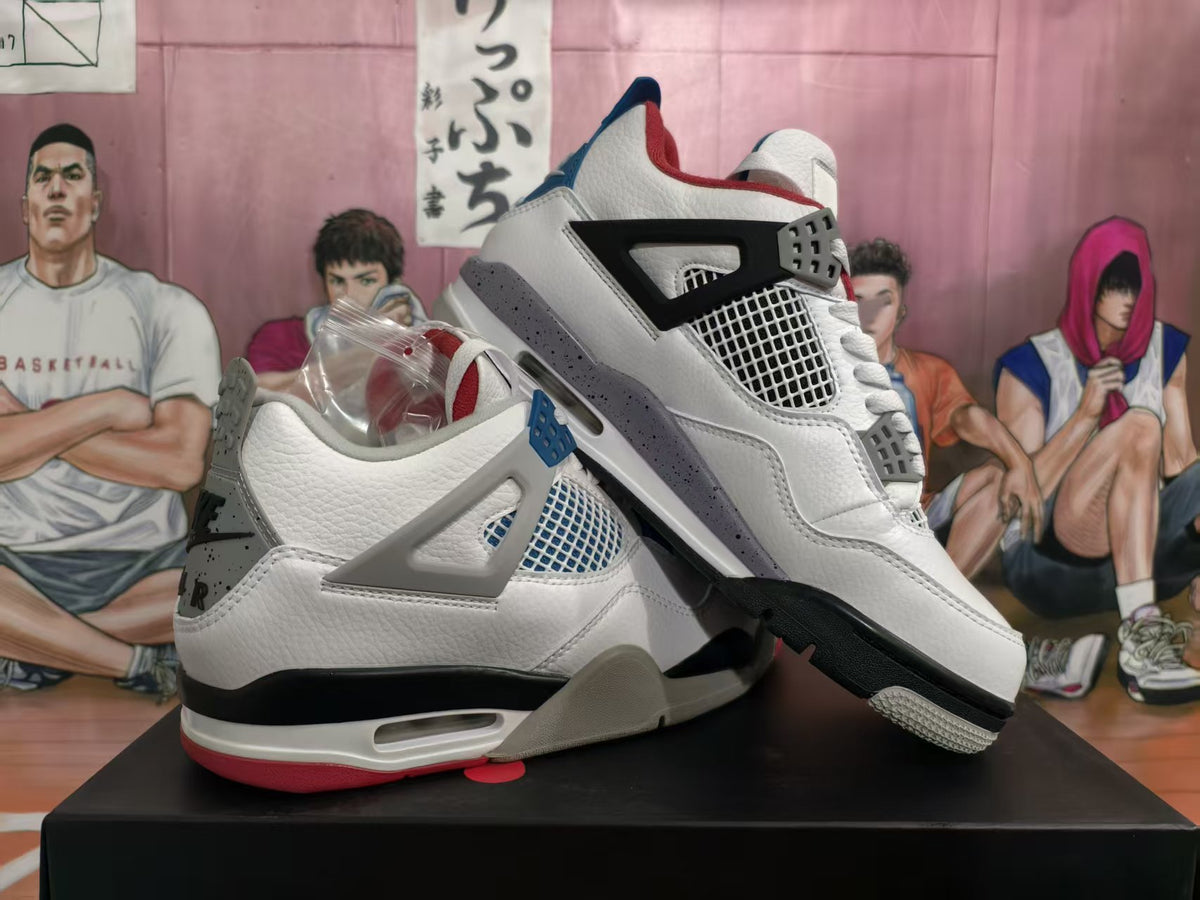 Pair of white Jordan high-top sneakers with blue, red, gray, and black accents, shown at an angle.