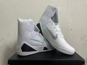 Pair of white high-top basketball shoes with patterned ankle panels, reflective Swooshes, and dark midsole accents.