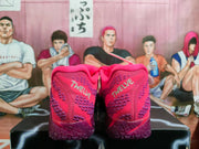 Rear view of pink and purple Nike basketball sneakers showing textured heels, purple outsole sections, and a basketball-themed background.