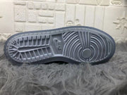 Underside view showing the textured rubber outsole and circular forefoot traction pattern.
