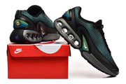 Black Nike sneakers with turquoise patterned uppers, gray midsoles, and a red shoe box
